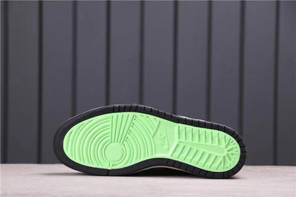 Outsole view showing a bright green traction section surrounded by black rubber.