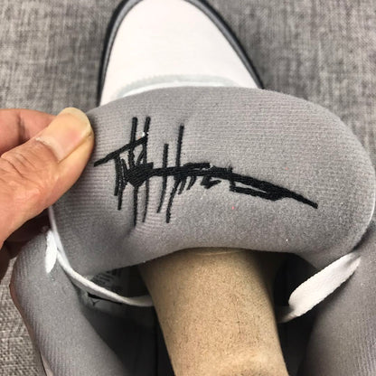 Close-up of the grey tongue lining with a black script-style mark.
