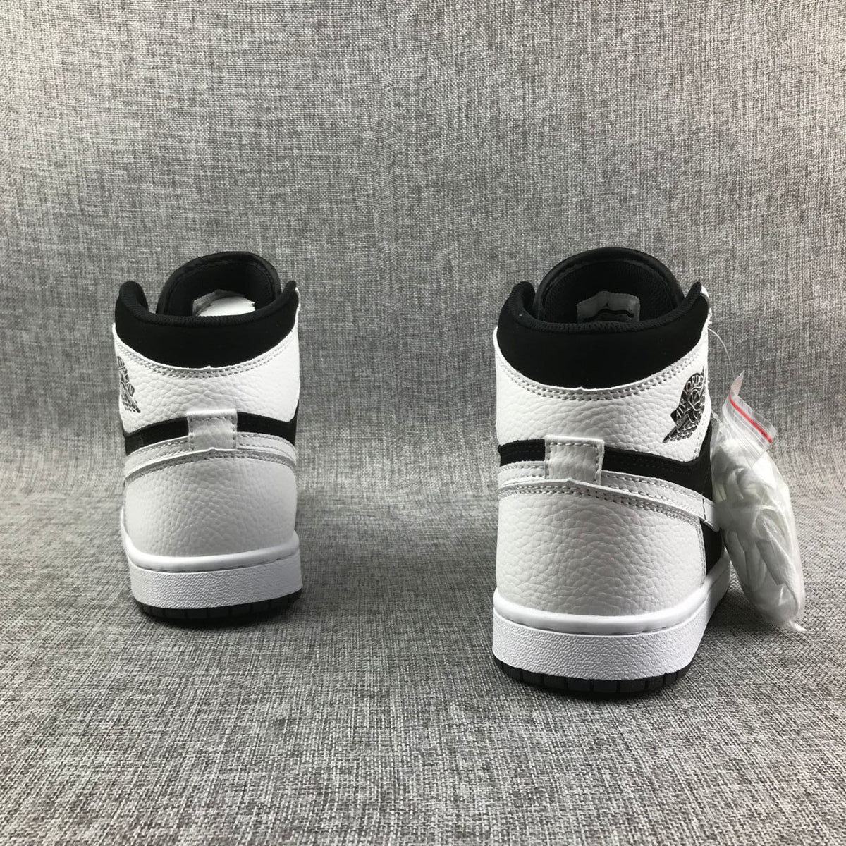 Rear view showing the black collar and white heel panels
