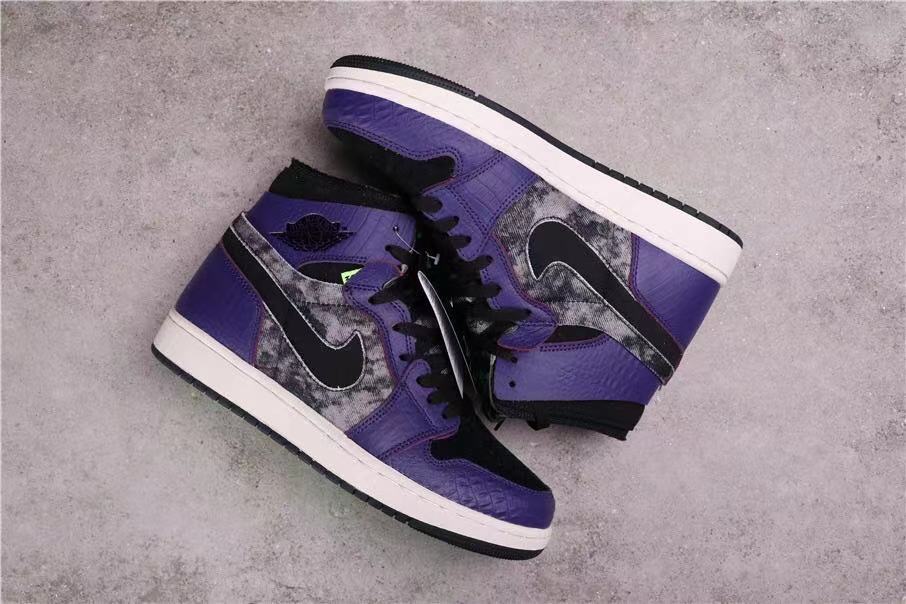 Side and overhead view of the paired black and purple high-top sneakers.
