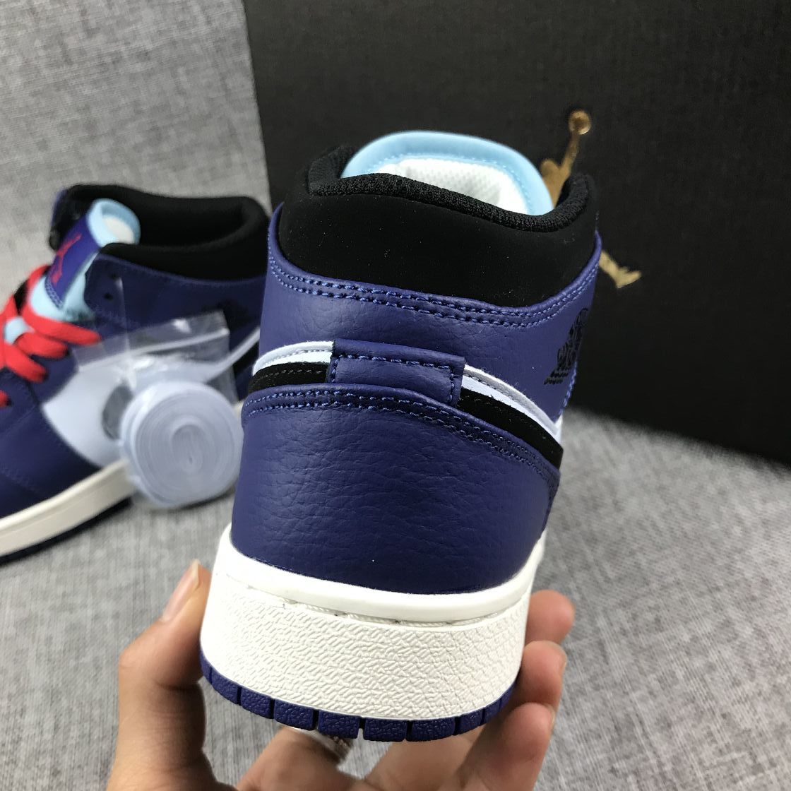 Close-up of the rear sneaker showing the purple heel panel and white midsole.