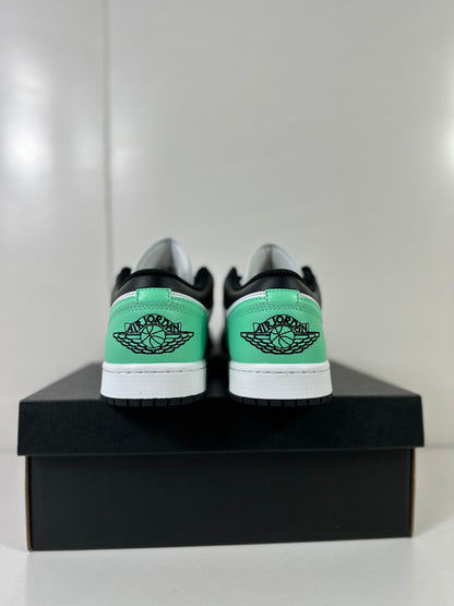 Rear view of the pair showing green heel panels and Jordan wing graphics.