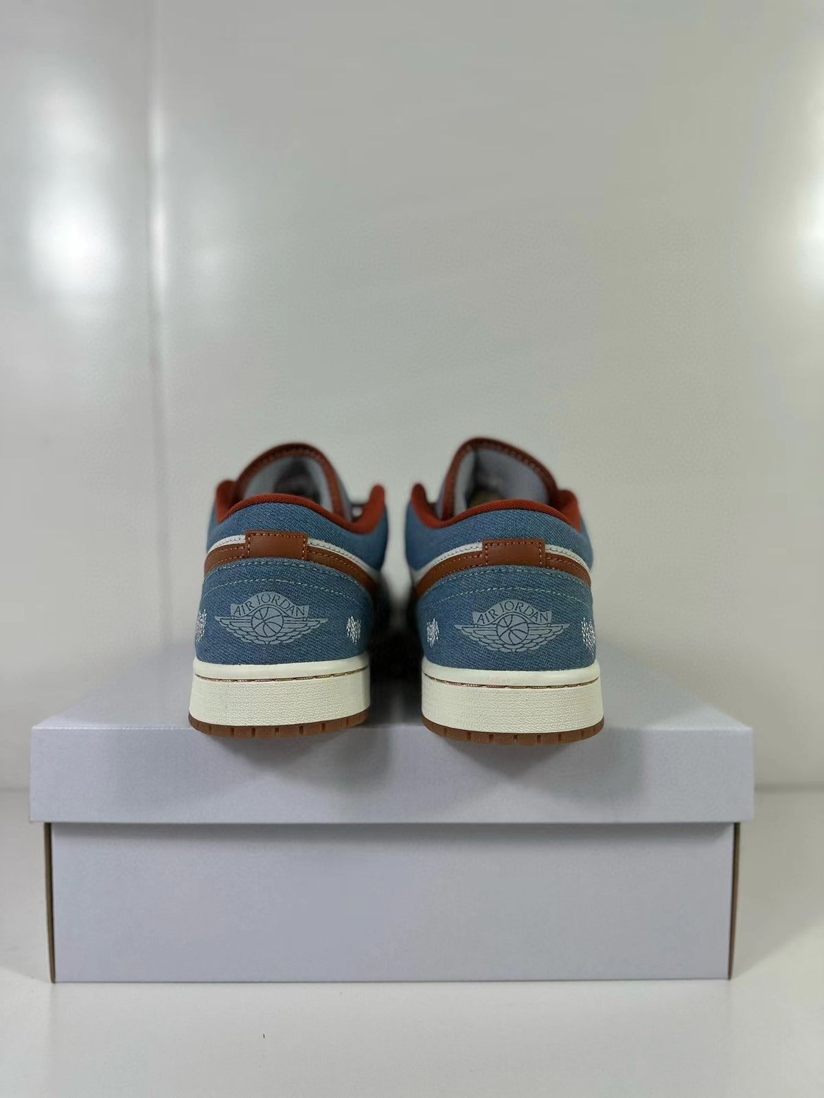 Rear view of the sneakers with blue heel panels