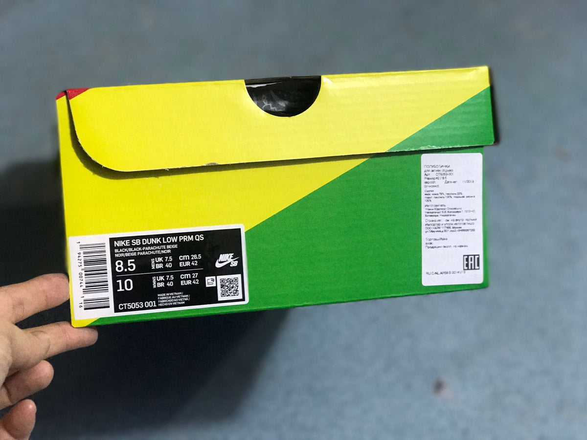 Nike SB Dunk Low PRM QS shoebox showing the product label, color description, style code CT5053-001, and a photographed EU 42 sample size.
