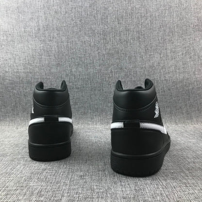 Rear view of a pair of black sneakers showing padded collars and contrasting white heel stripes.