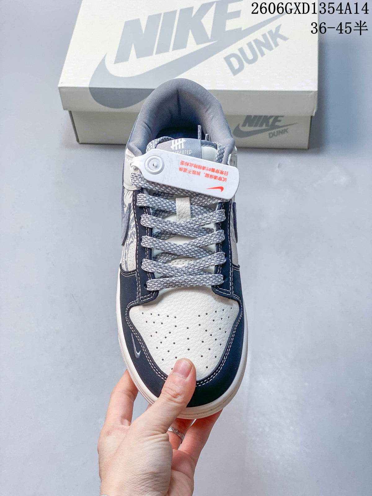 Nike Dunk Low x Undefeated Sneakers in White and Navy