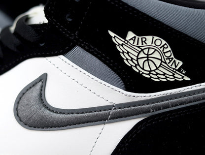 Close-up of the black, white and grey sneaker showing the Swoosh and Air Jordan winged logo.