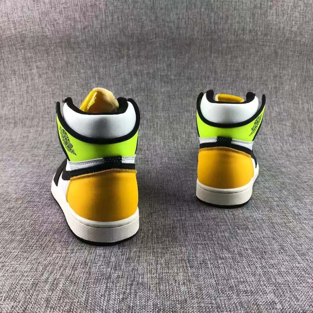 Rear pair view showing the yellow-gold heel sections and Volt collar panels.