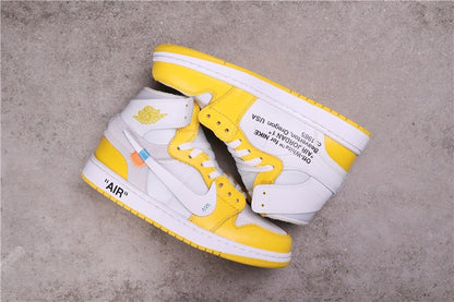 Overhead view of the pair showing the yellow and white color blocking and printed side details.