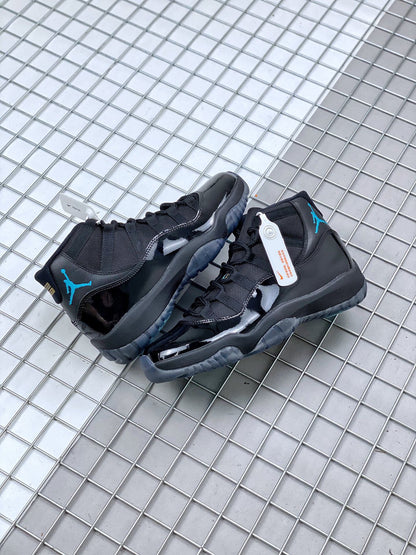 Pair of black sneakers shown together from the rear and side, with blue ankle and outsole accents.