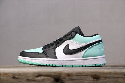 Opposite side view of a low-top Air Jordan 1 sneaker in black, white, and mint green.