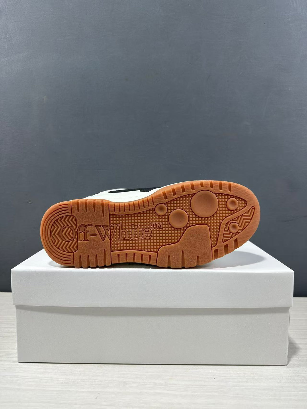 Bottom view showing the gum-colored patterned outsole with Off-White branding.