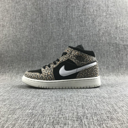 Side profile of the leopard-print mid-top sneaker with black panels and a white rubber outsole.