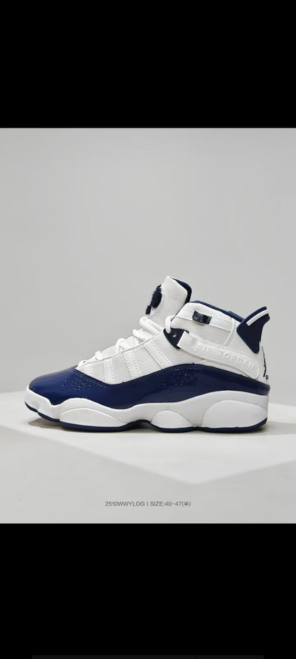 Side view of white and navy Jordan 6 Rings high-top sneakers on a light background.