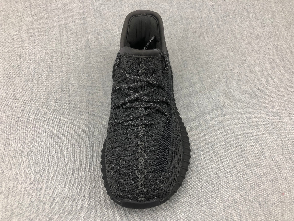 Top view showing the black laces, tongue, and knit-look toe area.