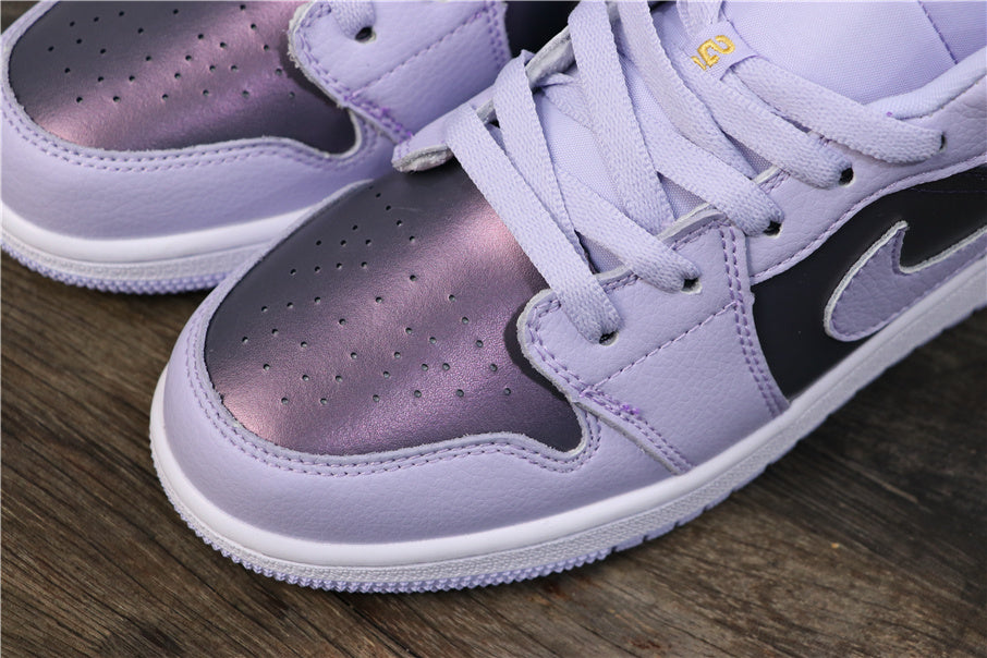 Close-up of the perforated metallic purple toe panel, light purple overlays, laces, and stitching.