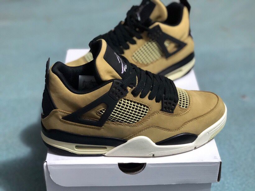 Jordan 4 Retro sneakers displayed from a three-quarter angle on top of a white shoe box.