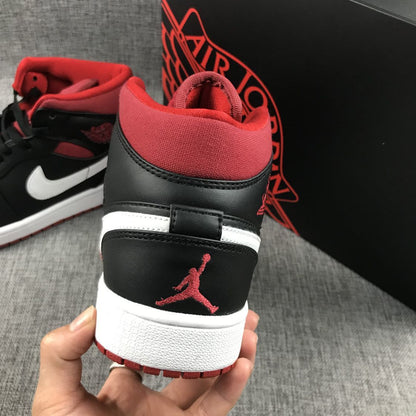 Close-up rear view showing the red collar, black heel panel, red Jumpman emblem, and red outsole.