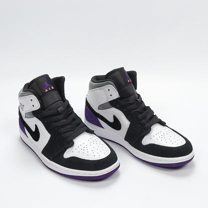 Three-quarter front view showing the black, white, and purple color blocking, padded collars, and high-top construction.