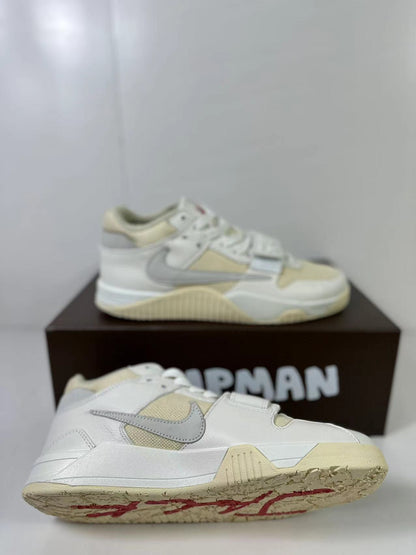 Side and outsole views of white and cream Jordan sneakers with a gray Swoosh, cream outsole, and red outsole graphic details.