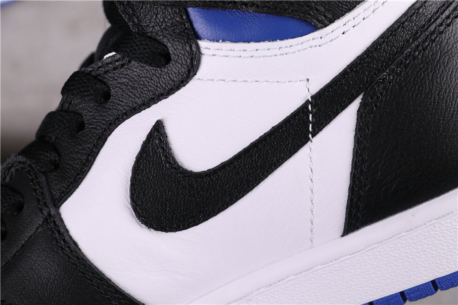 Close-up of a black Swoosh on a white side panel.