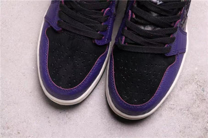 Close-up of the black perforated toe boxes with purple overlays and white midsoles.