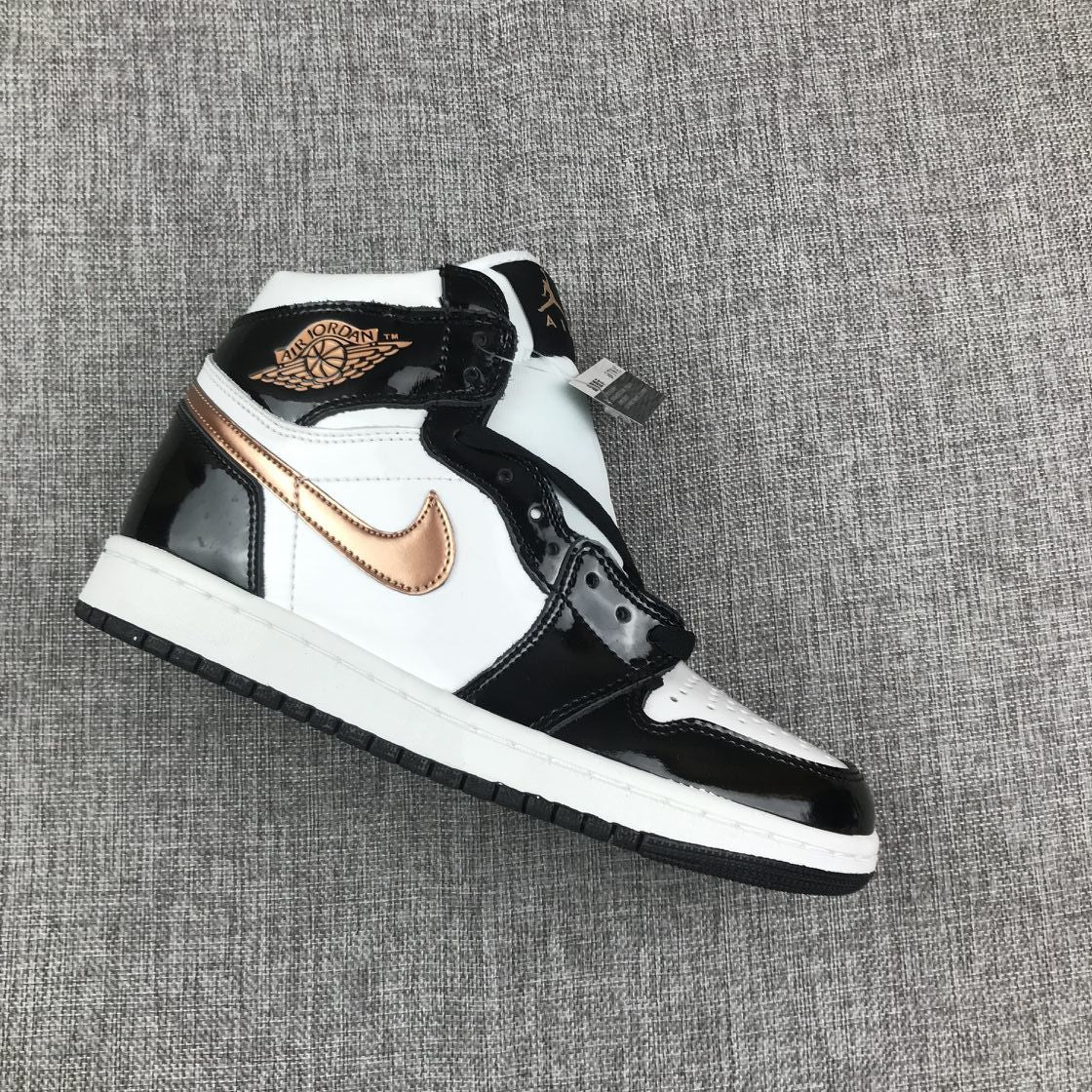 Single Air Jordan 1 Mid sneaker displayed at an angle, showing the perforated toe and high collar.