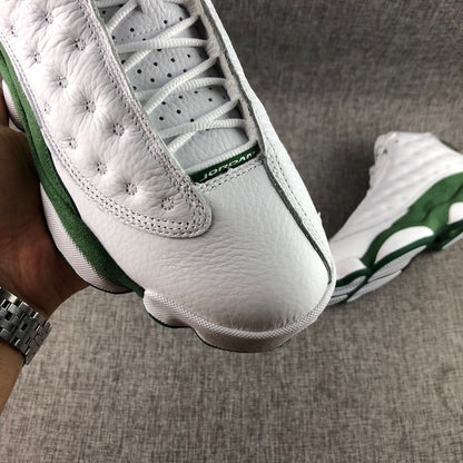 Close-up of the white toe box, laces, perforated tongue area, and textured side panel.