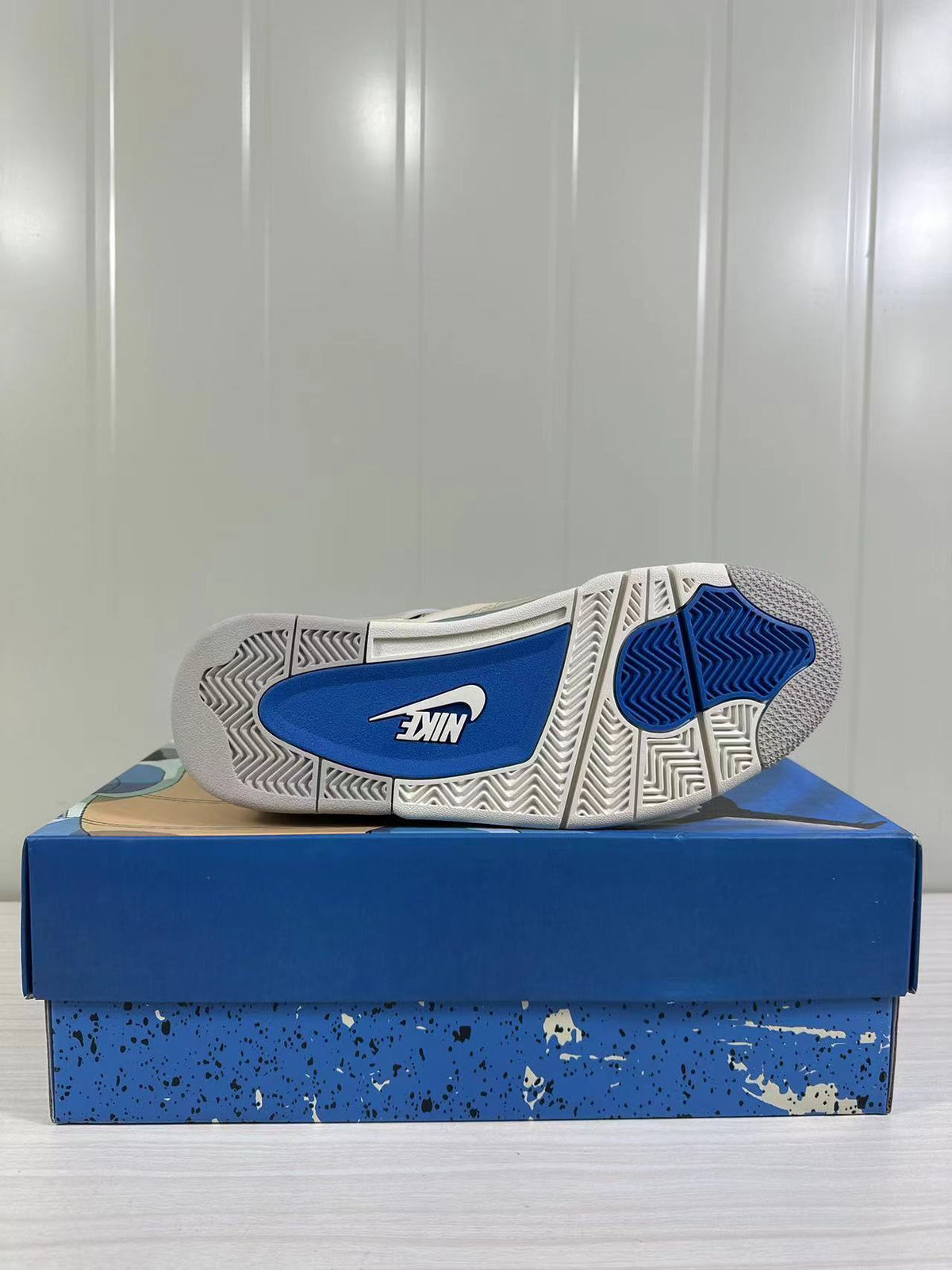 Bottom view showing the white and blue rubber outsole pattern and Nike branding.