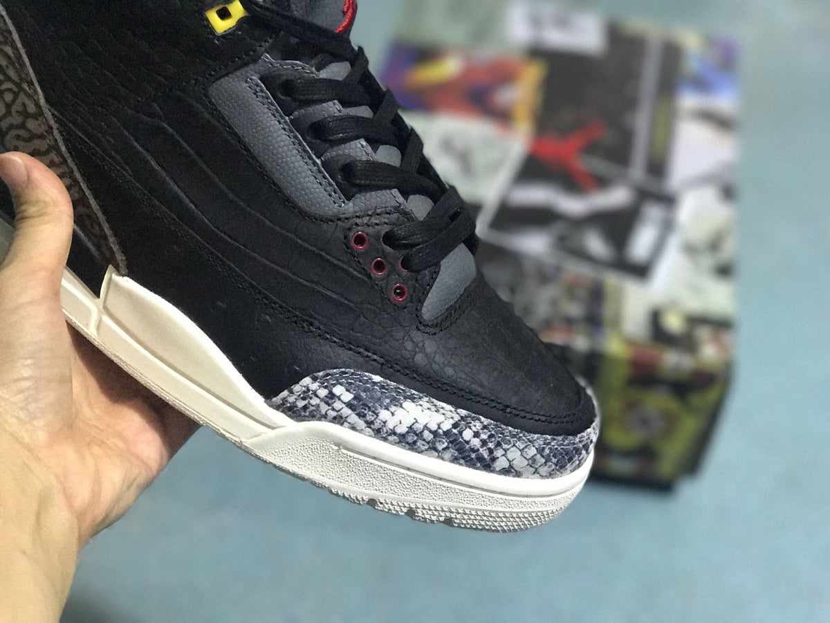 Close-up of the sneaker toe and lacing, including a contrasting patterned toe overlay.