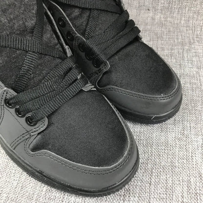 Close-up of the black textile toe boxes, matching overlays, and lace detail.