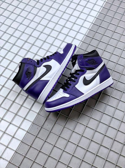 Pair of purple, white, and black high-top sneakers displayed on a metal grid surface.