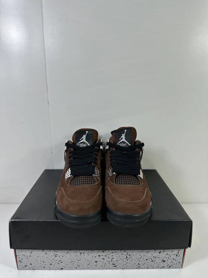 Front view of the pair showing black laces, brown toe panels, mesh tongues, and contrasting logos.
