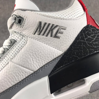 Close-up of the white textured upper, stitched Swoosh, black elephant-print overlay, and visible air window.