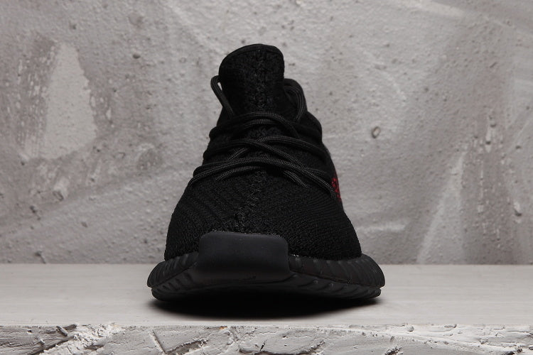 Front view showing the black knitted upper, laces, and dark outsole.