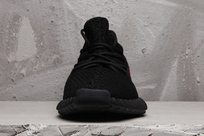 Front view showing the black knitted upper, laces, and dark outsole.