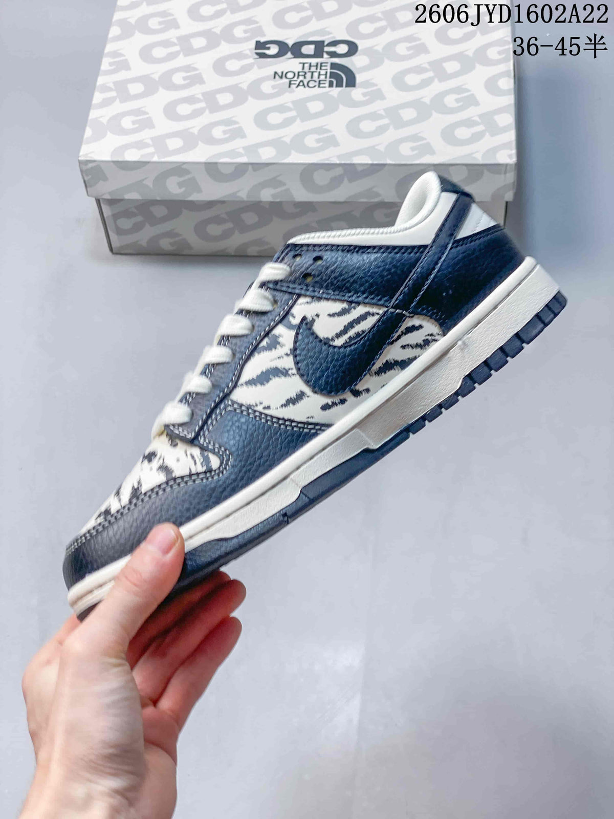 Nike SB Dunk Low Striped Cream and Navy Sneakers