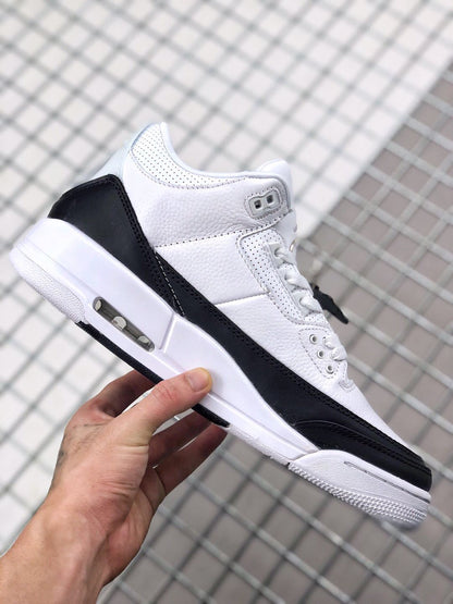 Side view showing the white upper, black overlays, midsole, and visible air window.
