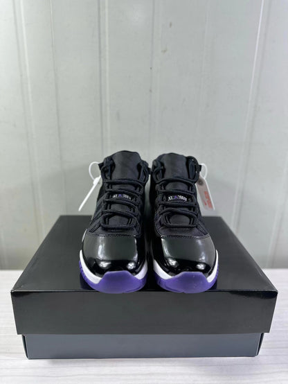 Front view of the pair showing the high-top silhouette, black laces, glossy toe panels, and purple outsole accents.