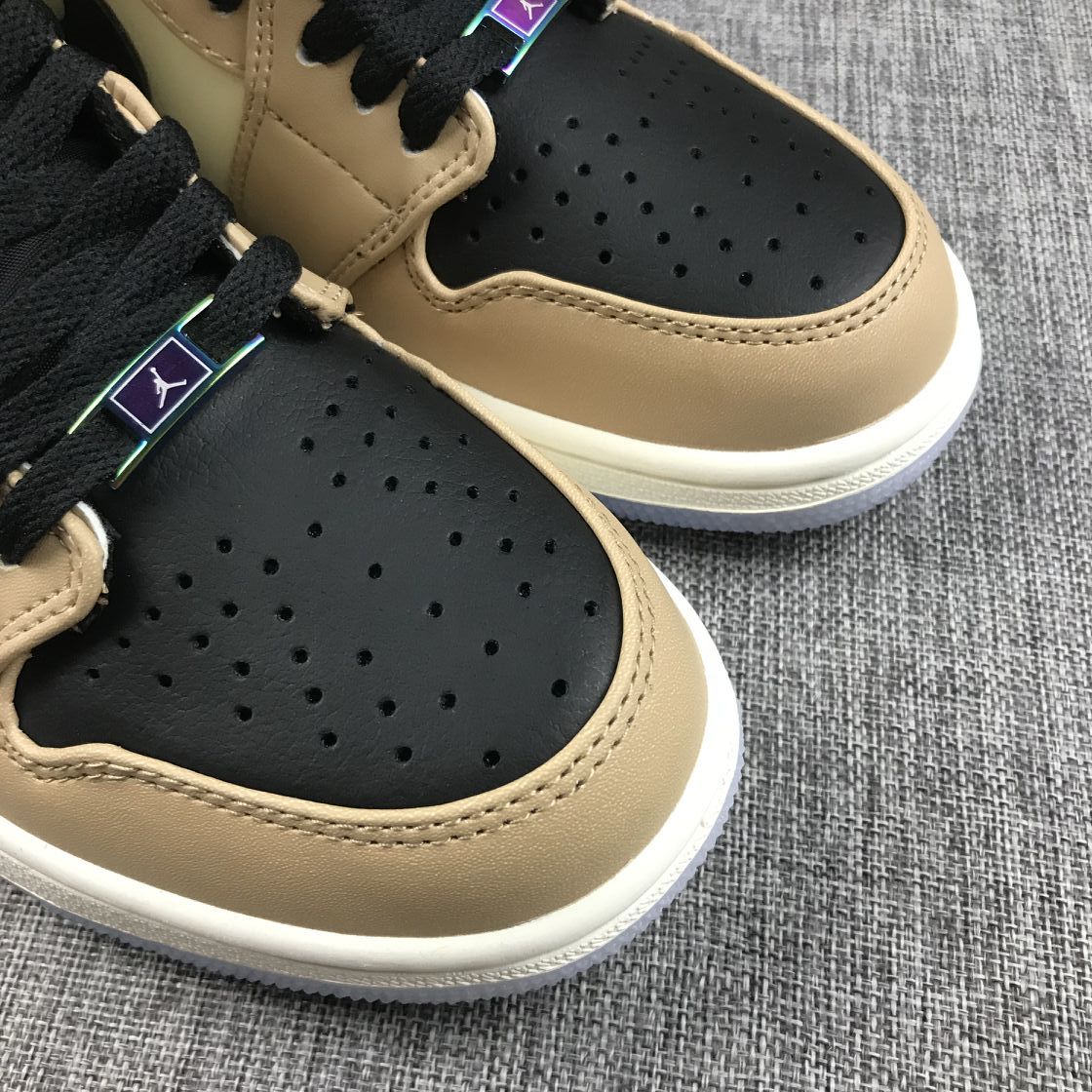 Close-up view of both perforated toe boxes and beige overlays.